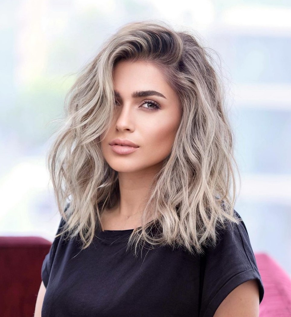 Shoulder-Length Ash Blonde Wavy Hairstyle