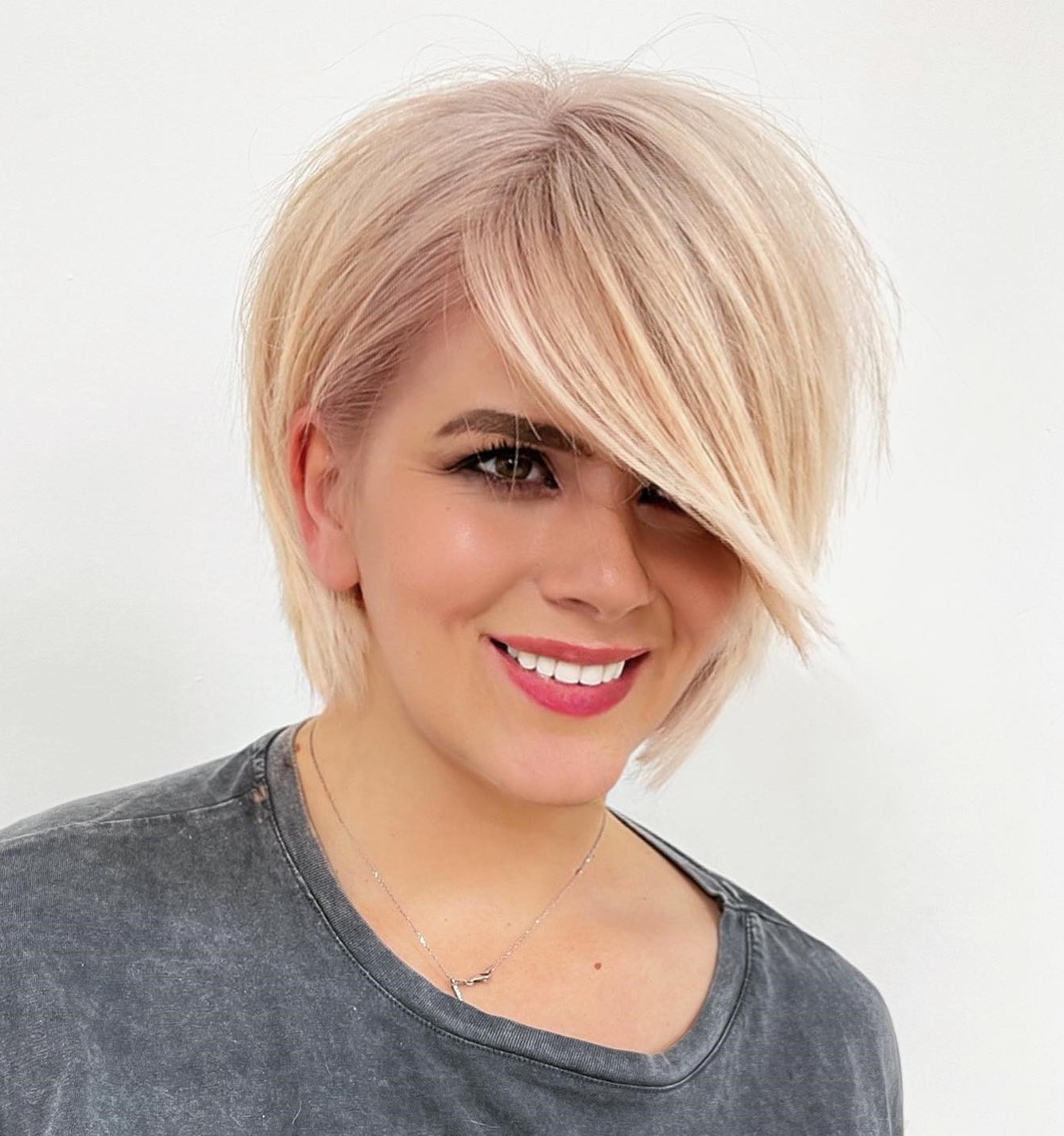 Blonde Tapered Bob with Side-Swept Bangs